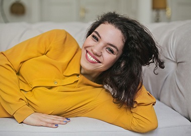 Woman in yellow shirt with beautiful smile