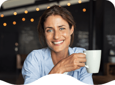 Smiling woman holding white coffee mug
