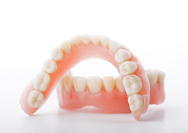 Set of removable dentures lying on a table