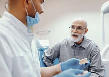 man asking his dentist questions about dental implants