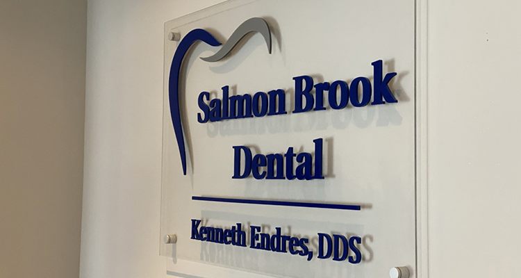 Salmon Brook Dental sign on wall