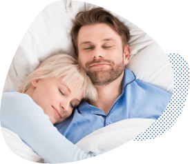 Man and woman sleeping soundly after sleep apnea therapy