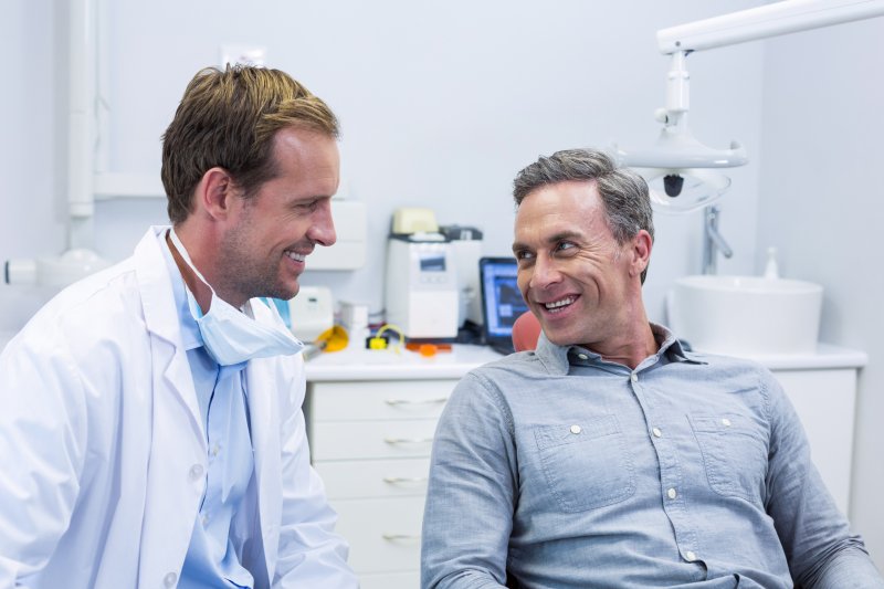 dentist explaining cosmetic dental bonding to patient